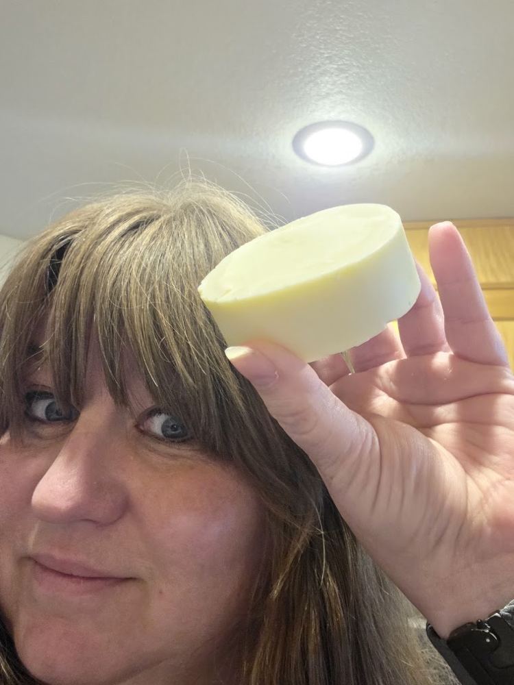 Logston holding up a bar of soap